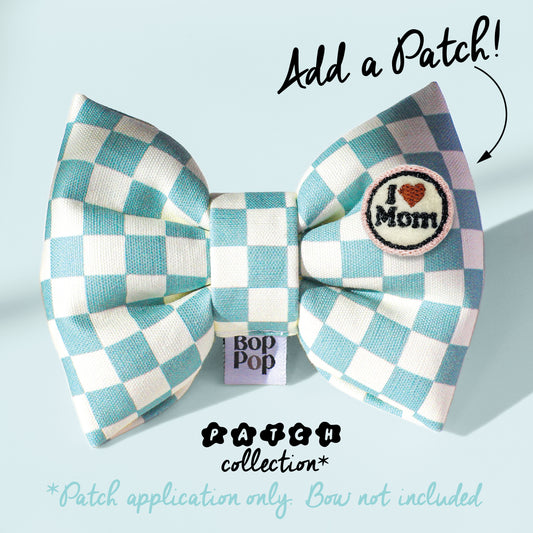 Checkered bow with 'I love Mom' patch on a light blue background