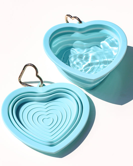 Collapsible portable aqua blue pet water or food bowl. Silicone and lightweight for cafe or travel. Gold heart carabiner by Bop Pop Pets. Aqua or blue lagoon color luxury style and elevated water bowl.