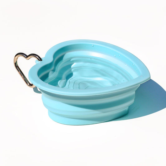 Collapsible portable aqua blue pet water or food bowl. Silicone and lightweight for cafe or travel. Gold heart carabiner by Bop Pop Pets. Aqua or blue lagoon color luxury style and elevated water bowl.