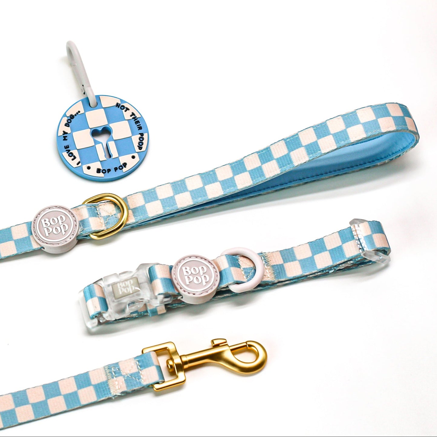Checkered dog leash and collar set with matching poop loop. Set of dog collars with checkered blue pattern and bop pop logo rubber tag. Sizes xs, small, medium and large pet accessories.