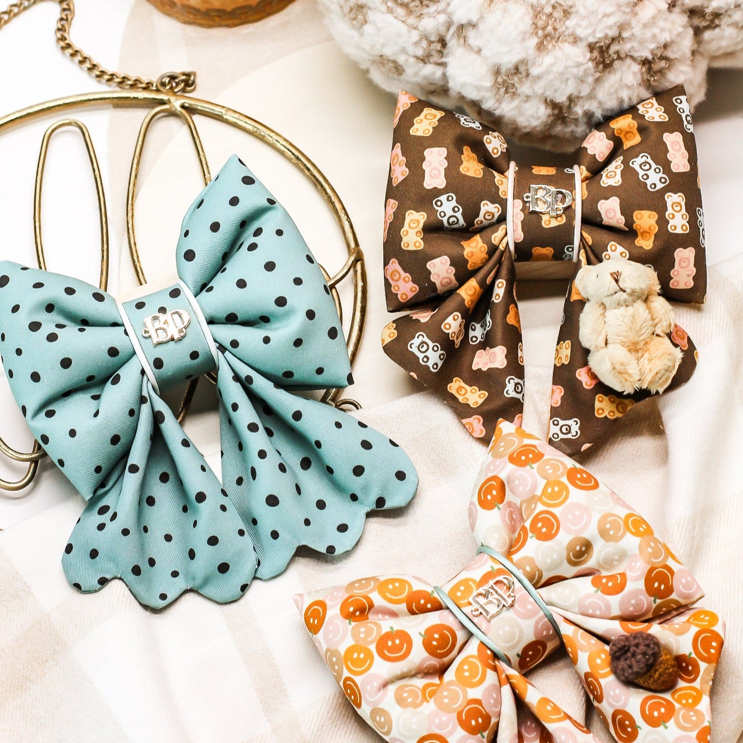 Colorful fabric bows on a white surface with decorative elements.