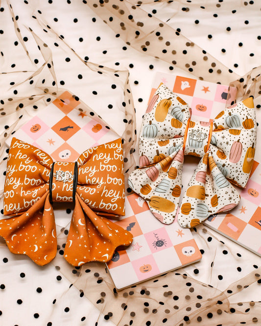 Halloween Bow Tie Collection of pumpkin patch, moon star celestial print cotton fabric with polka dot fabric background. Bop Pop Pets pet accessories bows and sailor bows for pets dogs and cats