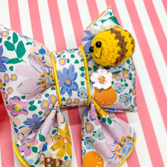 Colorful floral bow with crochet bee and metal flower daisy charm. Sailor bow for dog collars. Fashion dogs and dogmom style for beachy summer style vibes. Hand made design with neon super bright summer florals with oranges. Cutest dog accessory for dogs and cats.
