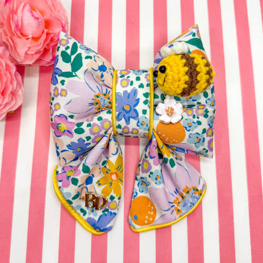 Colorful floral bow with crochet bee and metal flower daisy charm. Sailor bow for dog collars. Fashion dogs and dogmom style for beachy summer style vibes. Hand made design with neon super bright summer florals with oranges. Cutest dog accessory for dogs and cats.