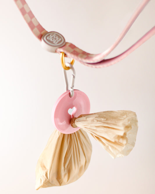 Dog leash with Poop Loop for used dog waste bag. Pink checkerboard print with matching dog walking set by Bop Pop Pets
