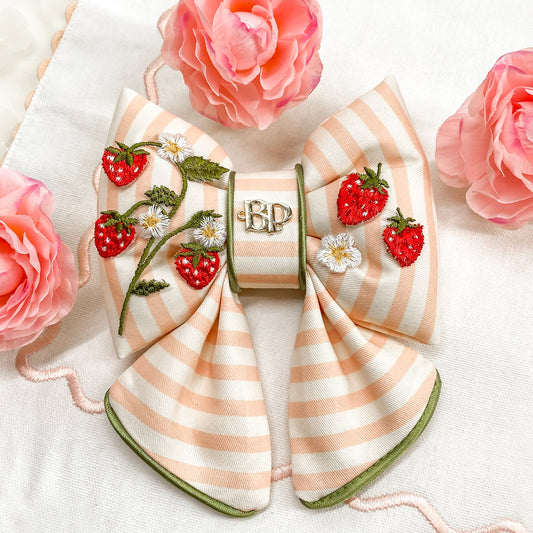 strawberry shortcake dog collar bow tie and sailor bow for pets dog or cat. Strawberry embroidery patch with organic cotton pink striped fabric. Dog mom girl dog style. Green olive satin trim on elevated pet bows and elevated pet accessories bop pop pets