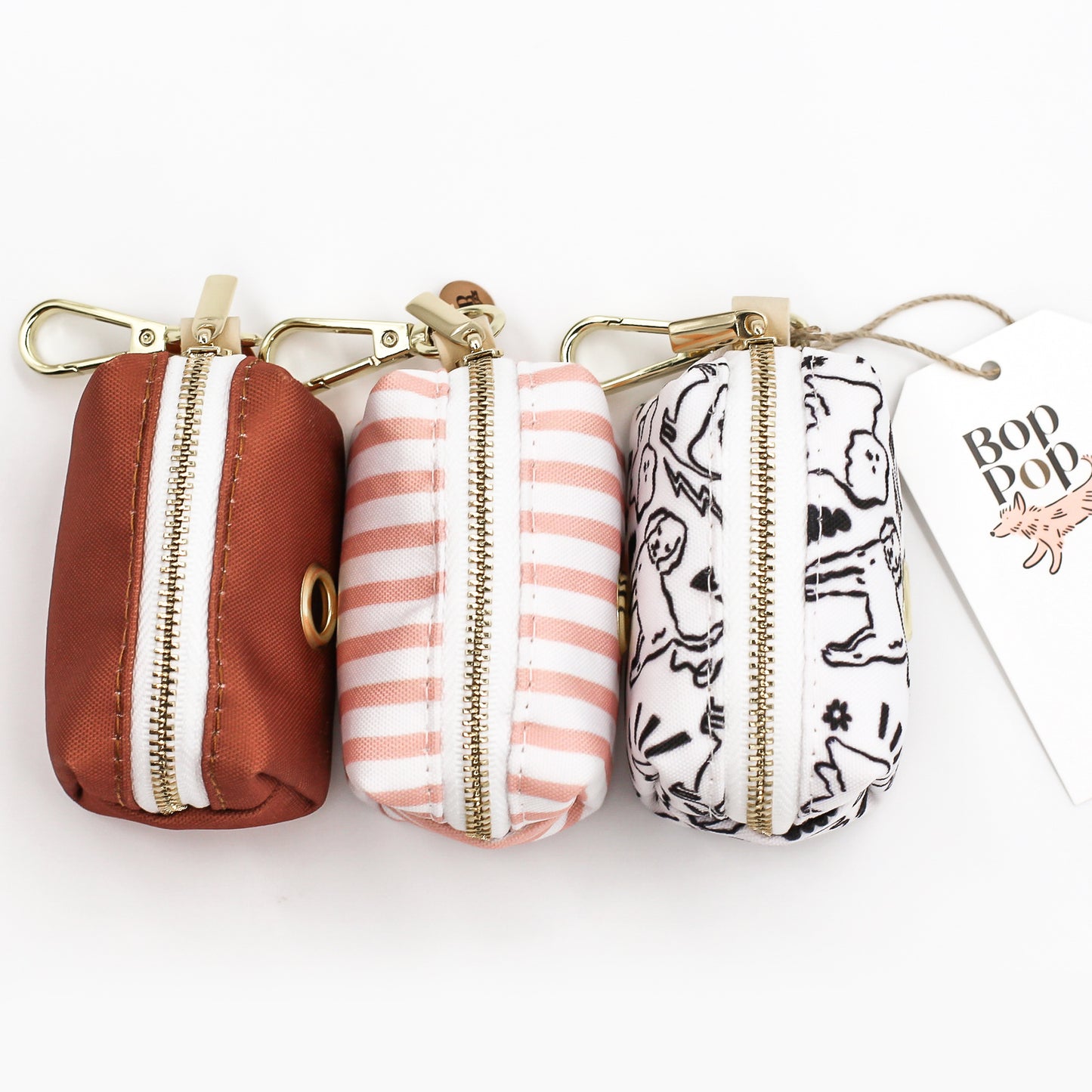 Poop Waste Bag dispenser for dogs pet accessory leash attachment for dog walking, travel and convenience Bop Pop Dog design modern natural gold swivel clasp hook Bop Pop tag Sienna Pink Stripes