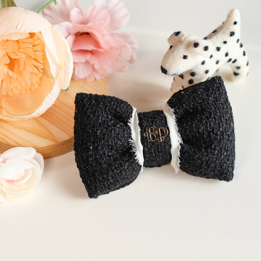 black tweed with gold and raw edge cream colored ribbon and gold metal logo. Bop Pop pet accessory