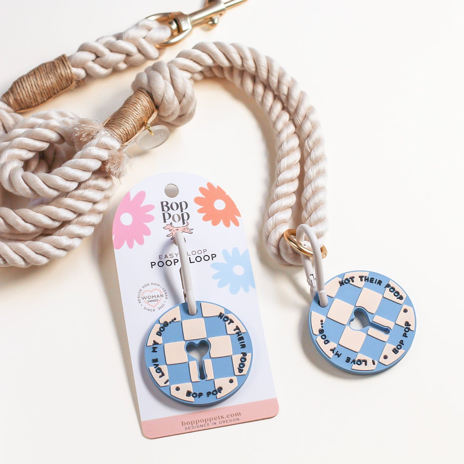 Dog leash with checkered poop loop with carabiner design on a white background