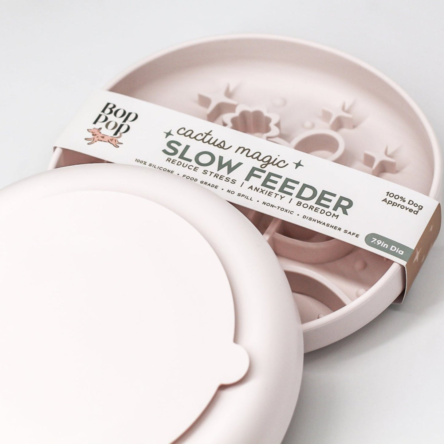Cactus Magic Slow Feeder staggered on white background with top feeder displayed with brand packaging labeled 'Cactus Magic SLOW FEEDER' and lower showing the backside view with large circle suction pad highlighting small tab on edge of suction.
