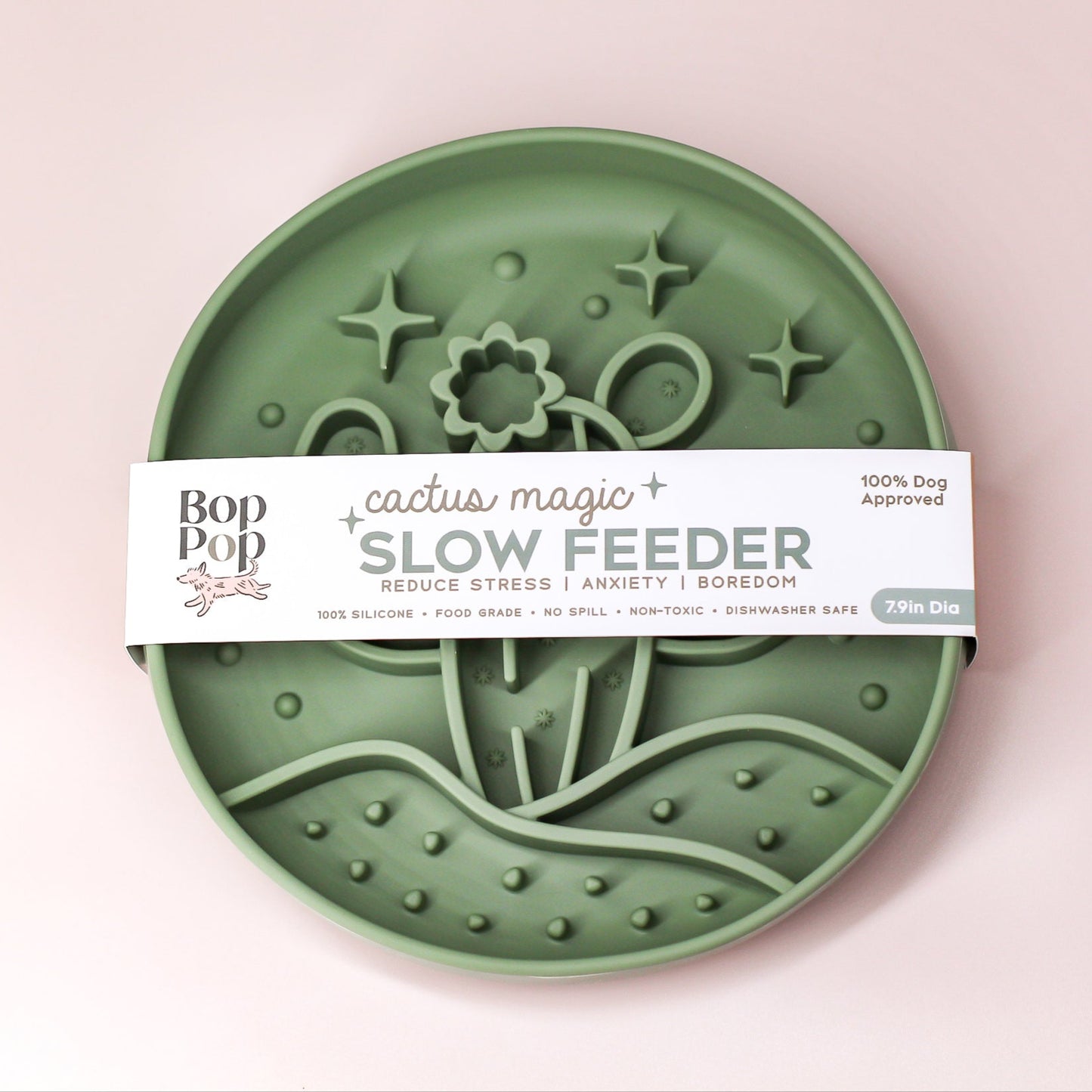 Cactus Magic Slow Feeder on blush white background with feeder displayed with brand packaging labeled 'Cactus Magic SLOW FEEDER' displaying 3 dimensional pattern partial view of cactus with blooming flower in the desert hill with
stars.