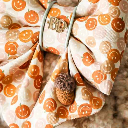 smiley face pumpkin pet bow tie sailor bow with scalloped details. Acorn crochet with pastel sage piping trim. Bop Pop Pet accessory. Cotton bows made in Oregon