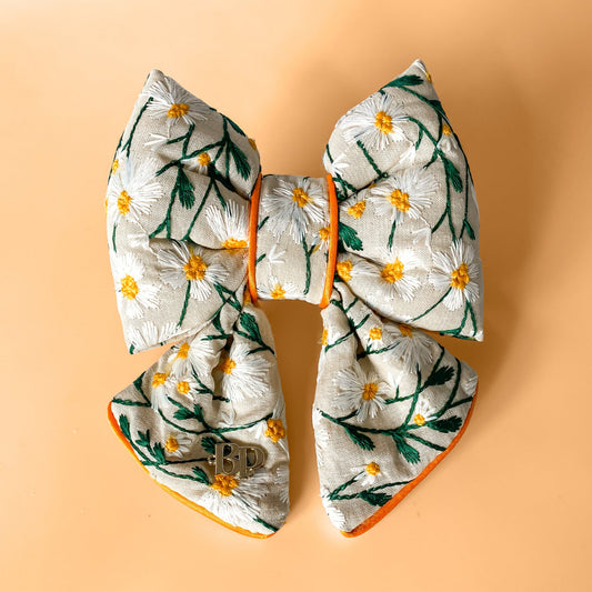 dog collar bow tie and sailor bow for pets dog or cat. flower daisy floral embroidery fabric embellishment. Dog mom girl dog style. Orange satin trim on elevated pet bows and elevated pet accessories bop pop pets fruit theme dog bows accessory