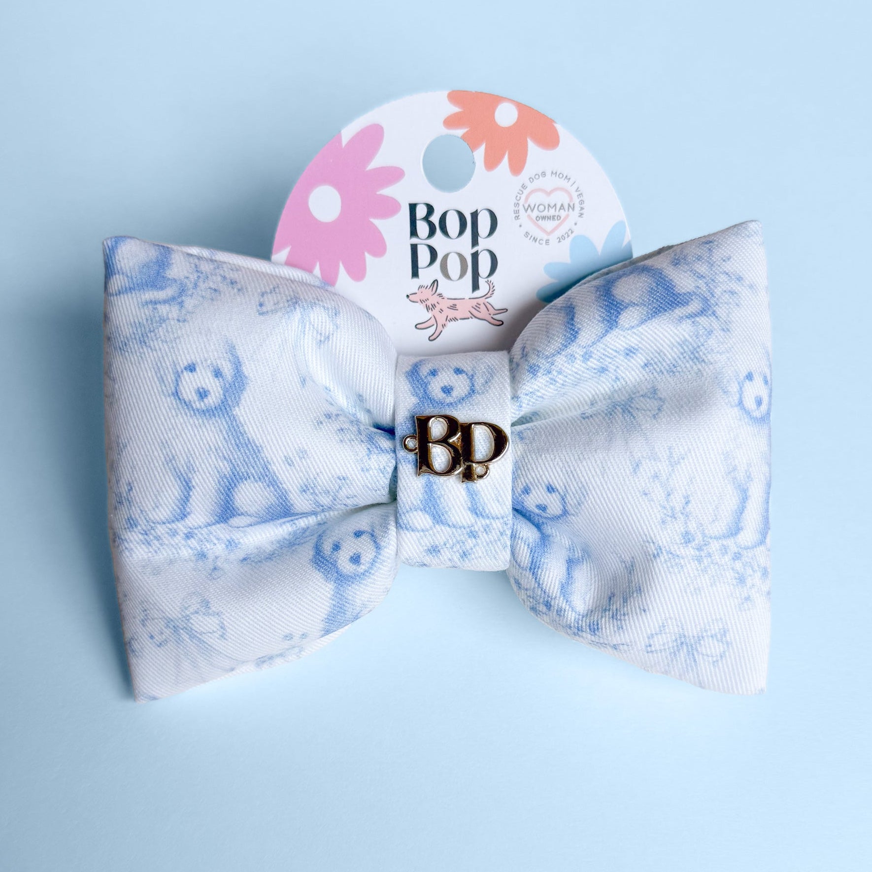Bow tie with 'Bop Pop' branding on a light blue background