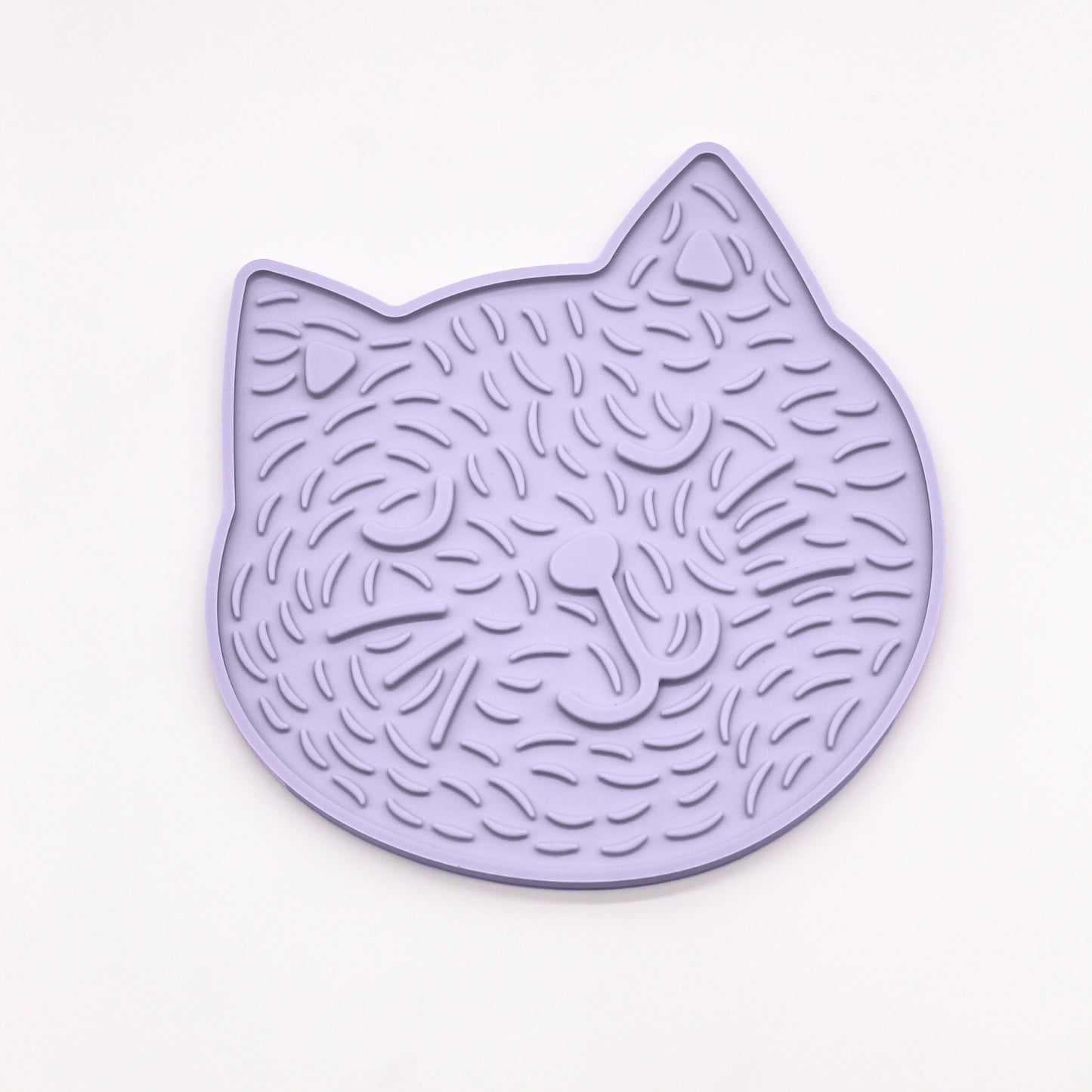 Happy Cat Kitty Lick mat for dogs cats kittens to reduce stress anxiety boredom Slow feeder shows a cartoon cat image on a lick mat with closed eye, smiling cat with ears and raised markings for fur details.