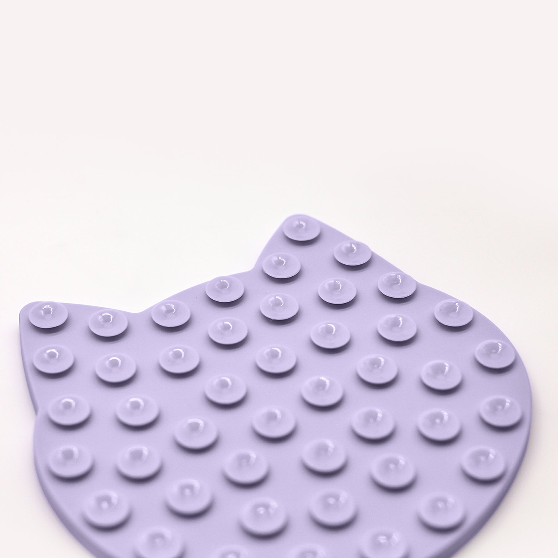 Happy Cat Kitty Lick mat backside view of multiple small circle suction cups on white background