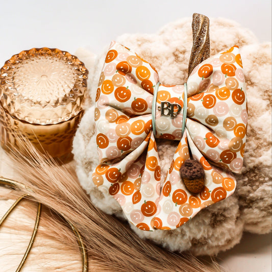 smiley face pumpkin pet bow tie sailor bow with scalloped details. Acorn crochet with pastel sage piping trim. Bop Pop Pet accessory. Cotton bows made in Oregon