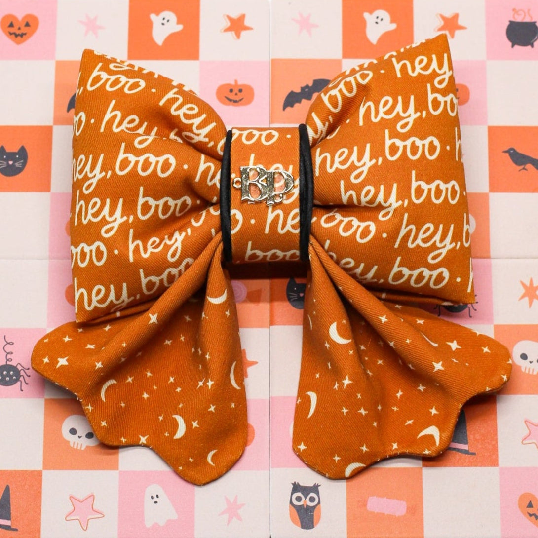 Hey Boo Halloween bow tie for pets dogs and cats. Scallop design with black satin piping trim for luxury elevated pet fashion. Bop Pop Pets puffy bow tie or sailor bows for premium handmade bows.