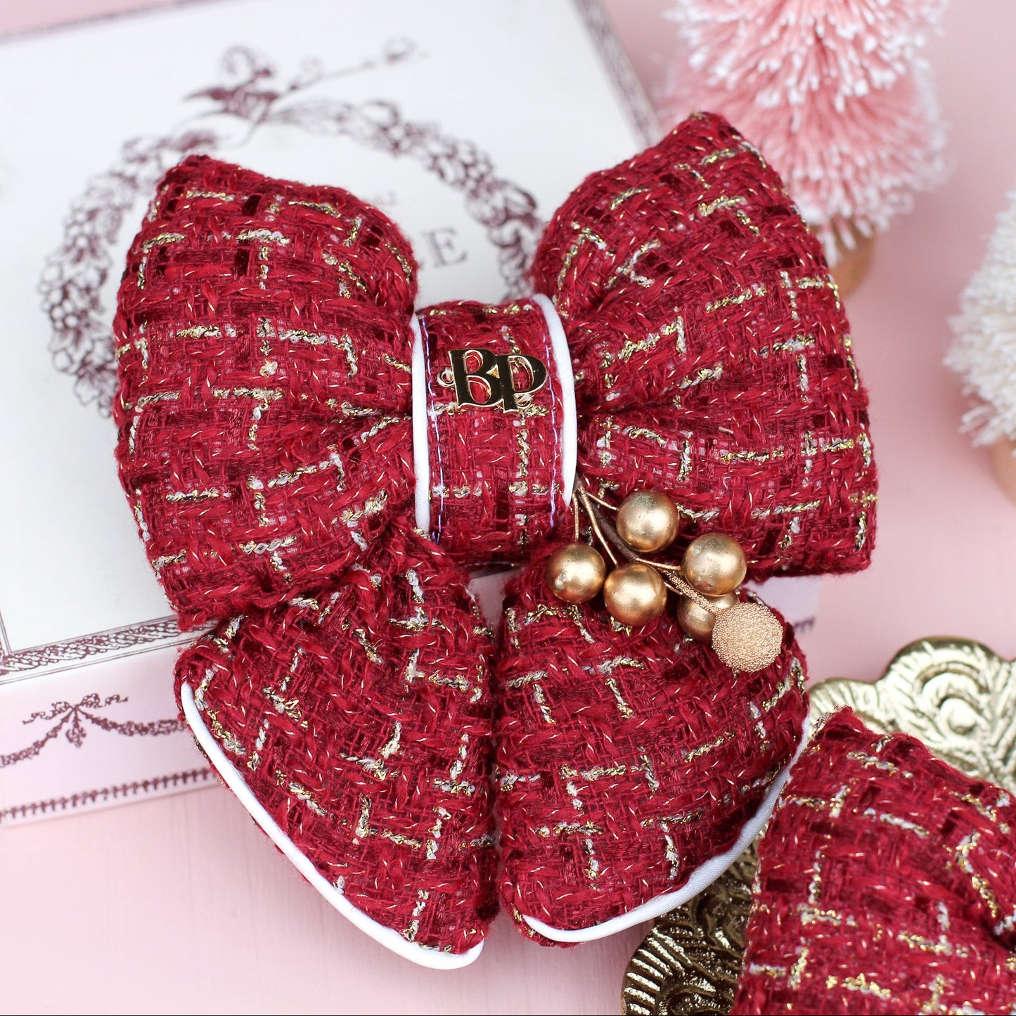 Red burgundy Tweed bow tie with gold holly foliage decorative decor. Holiday dog bows for premium handmade dog goods. Bop Pop Pets for festive style