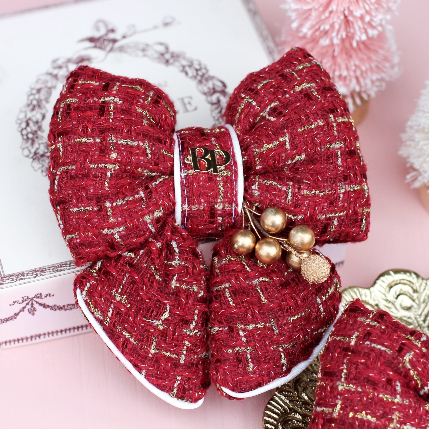 Red burgundy Tweed bow tie with gold holly foliage decorative decor. Holiday dog bows for premium handmade dog goods. Bop Pop Pets for festive style