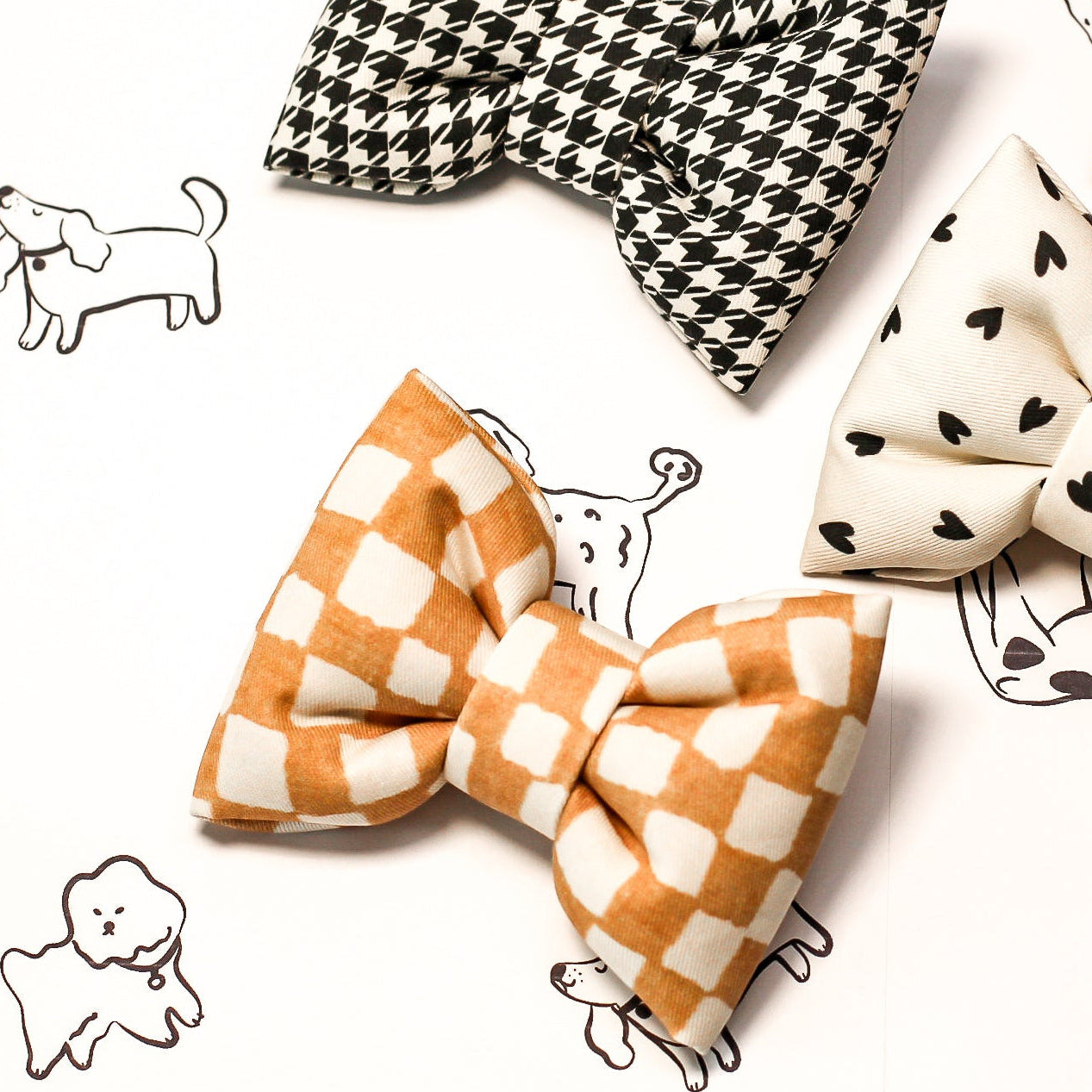 Checkered bow tie with other bow ties and a dog illustration on a white background