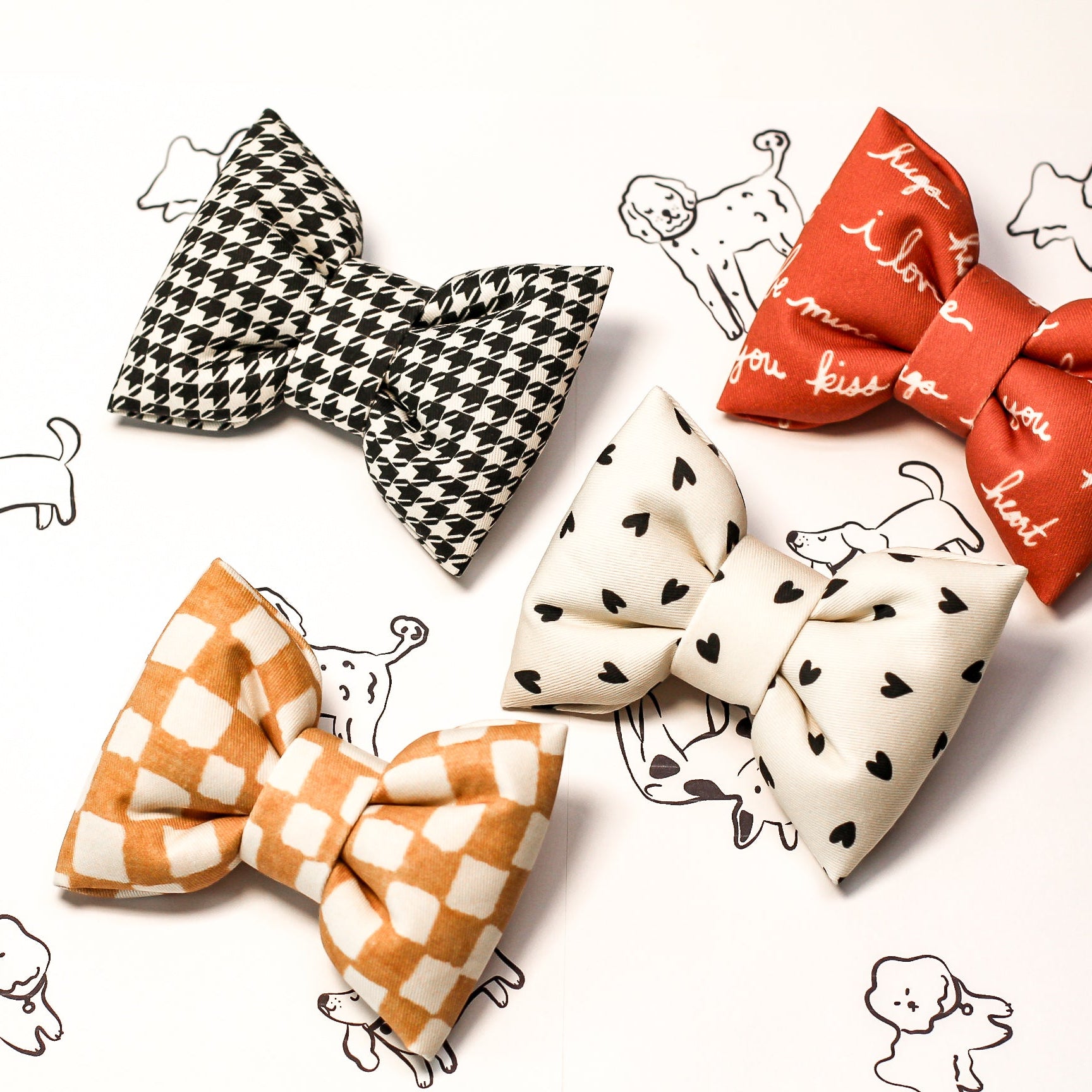 Houndstooth dog bow tie with various patterns with checkerboard and hearts on a white background with small dog illustrations. Bop Pop Pets pet accessories.