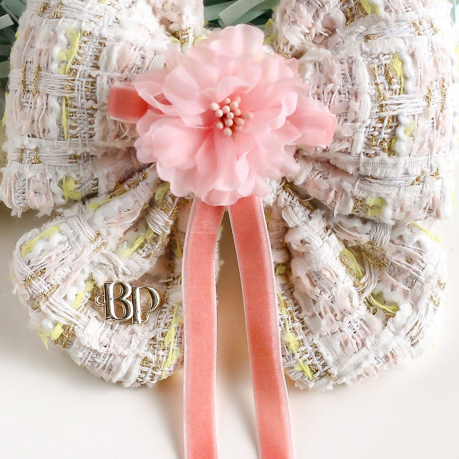 Decorative Easter basket with pastel colors and Easter eggs on a white background