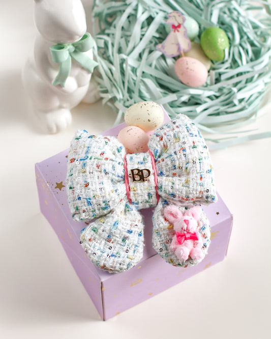 Decorative bow with Easter-themed elements on a white background