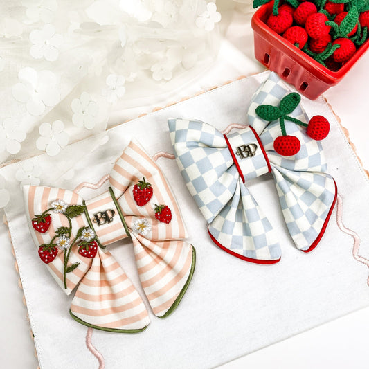 strawberry shortcake dog collar bow tie and sailor bow for pets dog or cat. Strawberry embroidery patch with organic cotton pink striped fabric. Dog mom girl dog style. Green olive satin trim on elevated pet bows and elevated pet accessories bop pop pets cherry theme fruit theme dog bows accessory