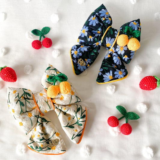 dog collar bow tie and sailor bow for pets dog or cat. flower daisy floral embroidery fabric with lemon 3D crochet embellishment. Dog mom girl dog style. Green olive satin trim on elevated pet bows and elevated pet accessories bop pop pets fruit theme dog bows accessory