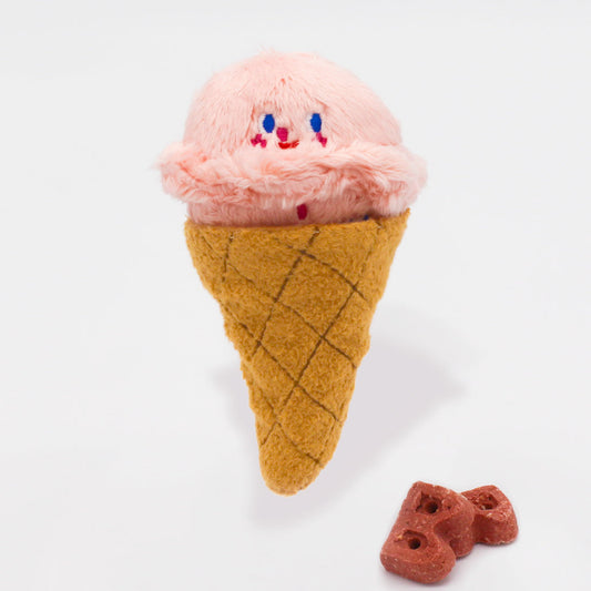 Plush ice cream cone toy with pink ice cream and brown waffle cone on a white background