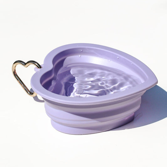 Collapsible portable purple pet water or food bowl. Silicone and lightweight for cafe or travel. Gold heart carabiner by Bop Pop Pets. Lavender purple color luxury style and elevated water bowl.