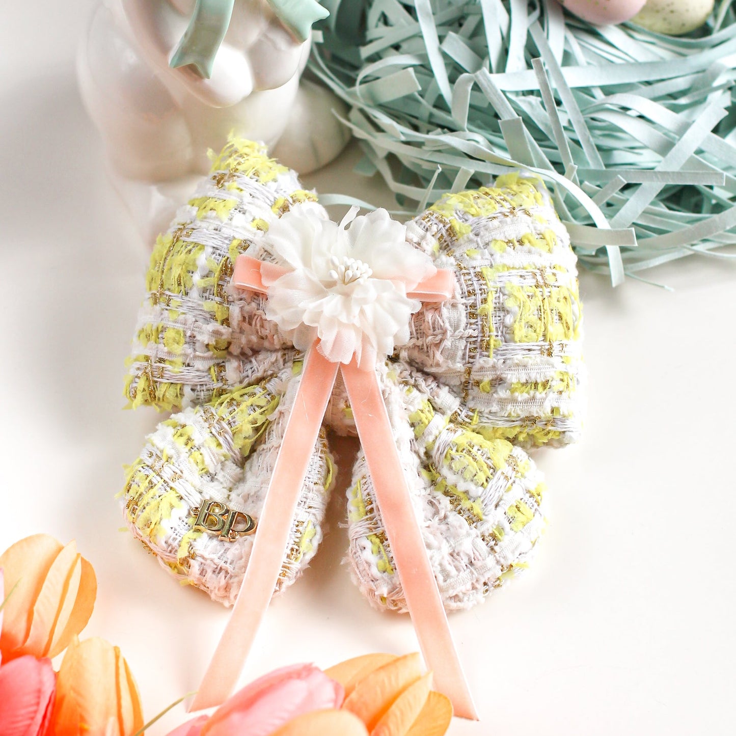 Decorative wreath with pastel colors and Easter elements on a white background