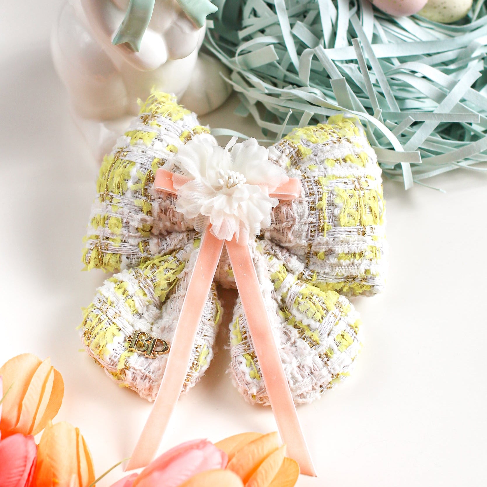 Decorative wreath with pastel colors and Easter elements on a white background