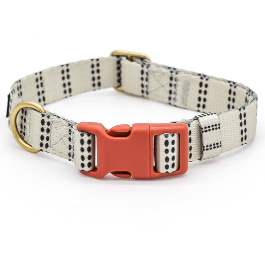 Dog collar with a modern farmhouse style pattern and  brick orange rust colored buckle on a white background