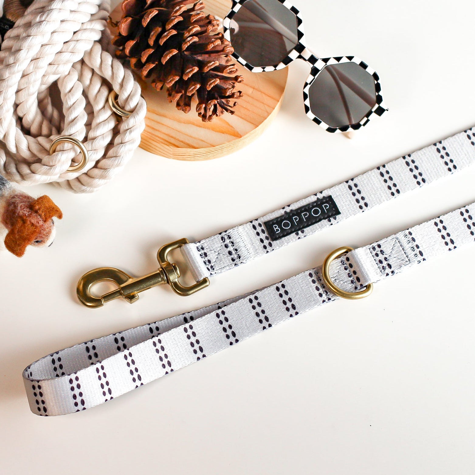 Dog leash with patterned design on a light background