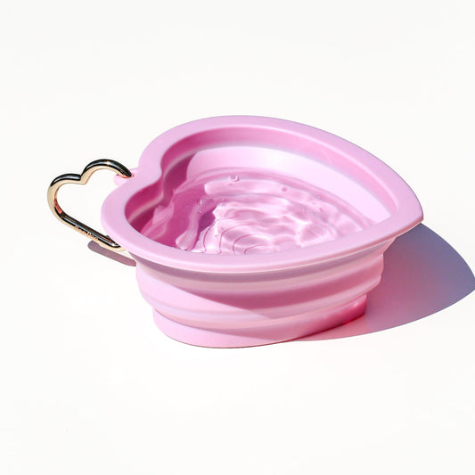 Collapsible portable pink pet water or food bowl. Silicone and lightweight for cafe or travel. Gold heart carabiner by Bop Pop Pets. Bright bubblegum pink color luxury style and elevated water bowl.