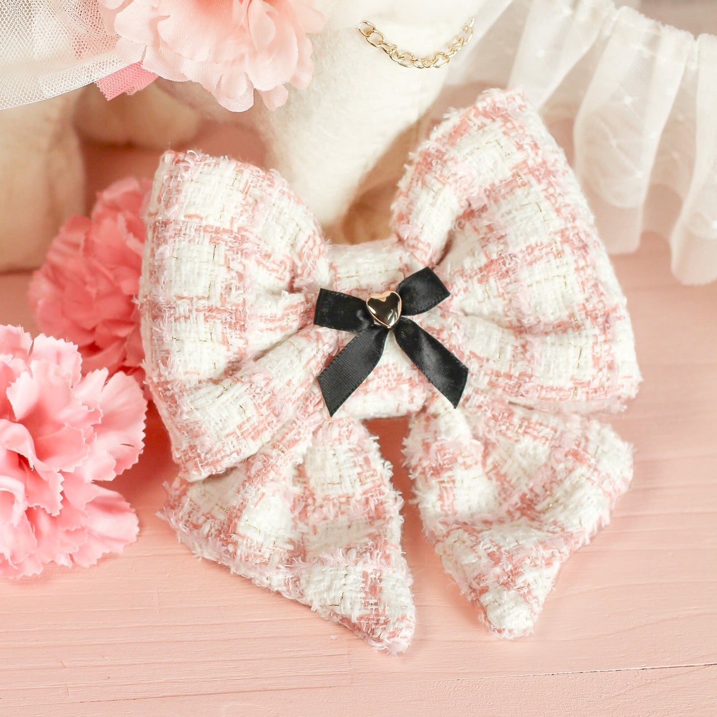 White pink lattice plaid soft tweed chenille sailor bow and decorative flowers on a pink background. Bop Pop Pets pet bow accessory.