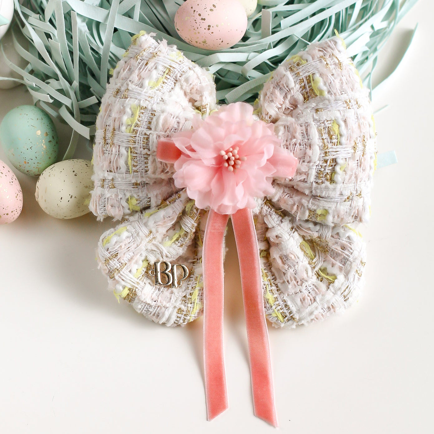 Decorative Easter basket with pastel colors and Easter eggs on a white background