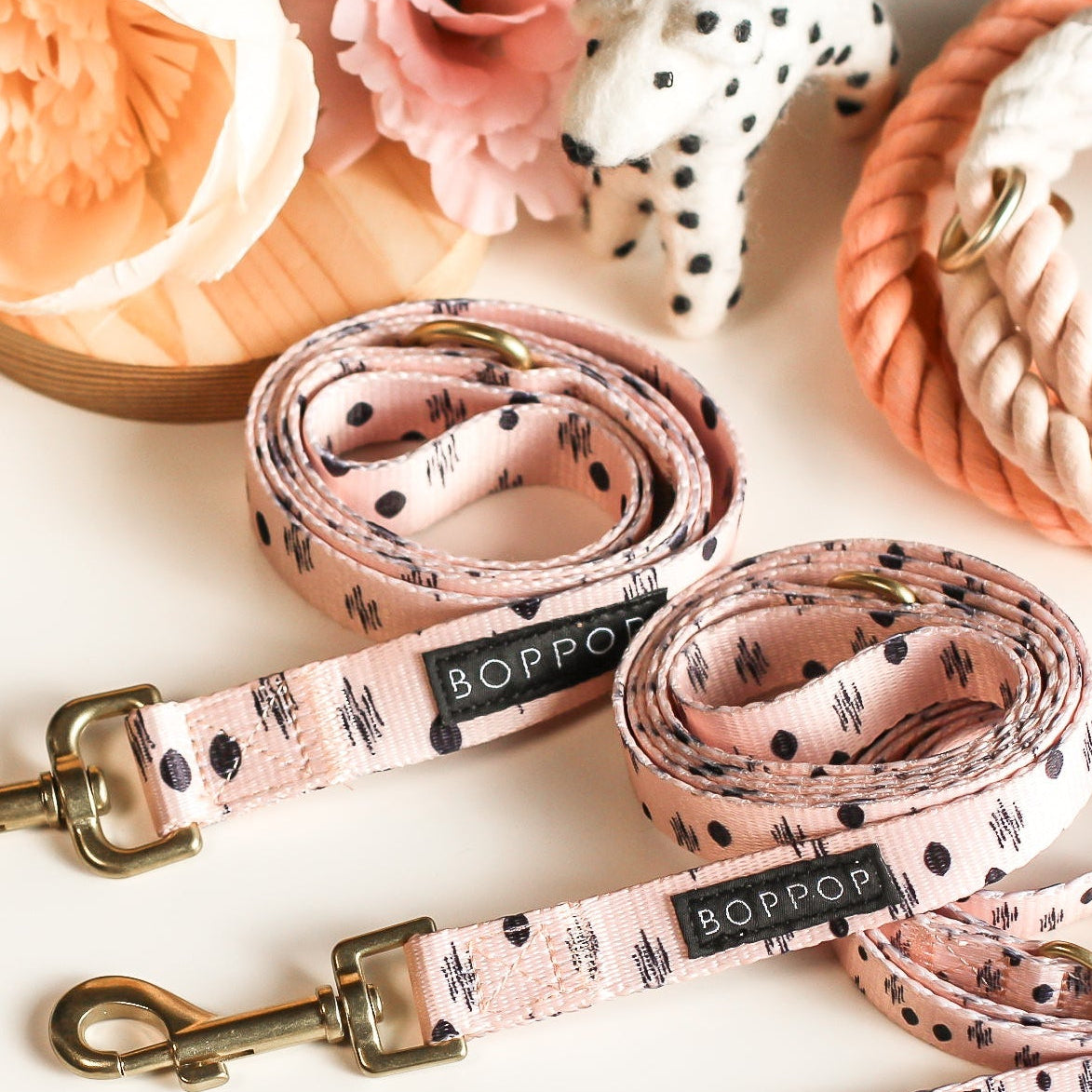 Dog leashes with floral pattern and 'SOPHIE' branding on a light background