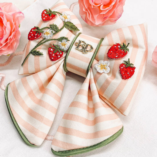 strawberry shortcake dog collar bow tie and sailor bow for pets dog or cat. Strawberry embroidery patch with organic cotton pink striped fabric. Dog mom girl dog style. Green olive satin trim on elevated pet bows and elevated pet accessories bop pop pets puffy bows