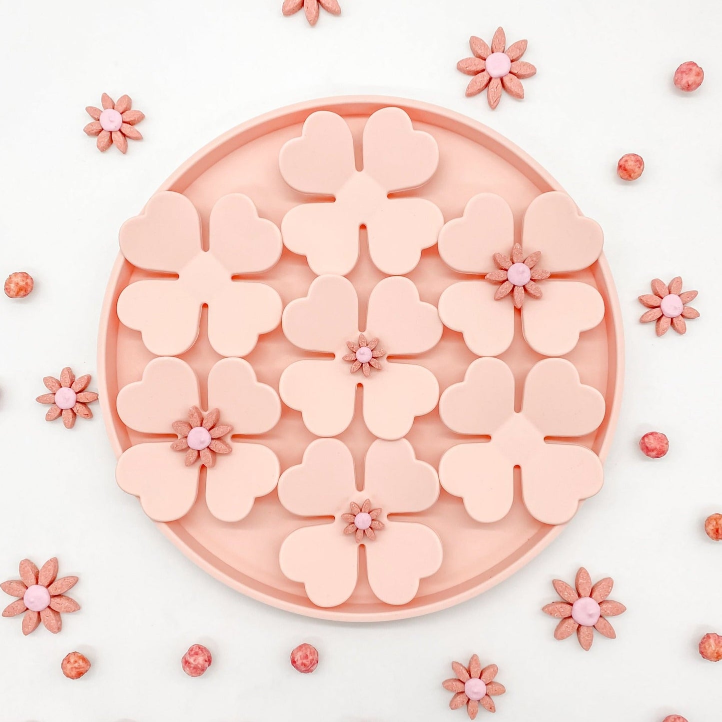 Snuffle Mat Blossom Rose Pink Silicone BPA Free slow feeder dog cat pet bowl mealtime enrichment anti-anxiety feeder featured on white background with small pink flower dog treats sprinkled in a pretty pattern