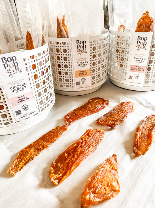 Homemade dehydrated organic chicken breast jerky dog treat for dogs. Sweet potato mash organic bbq sauce vacuum packed individual servings